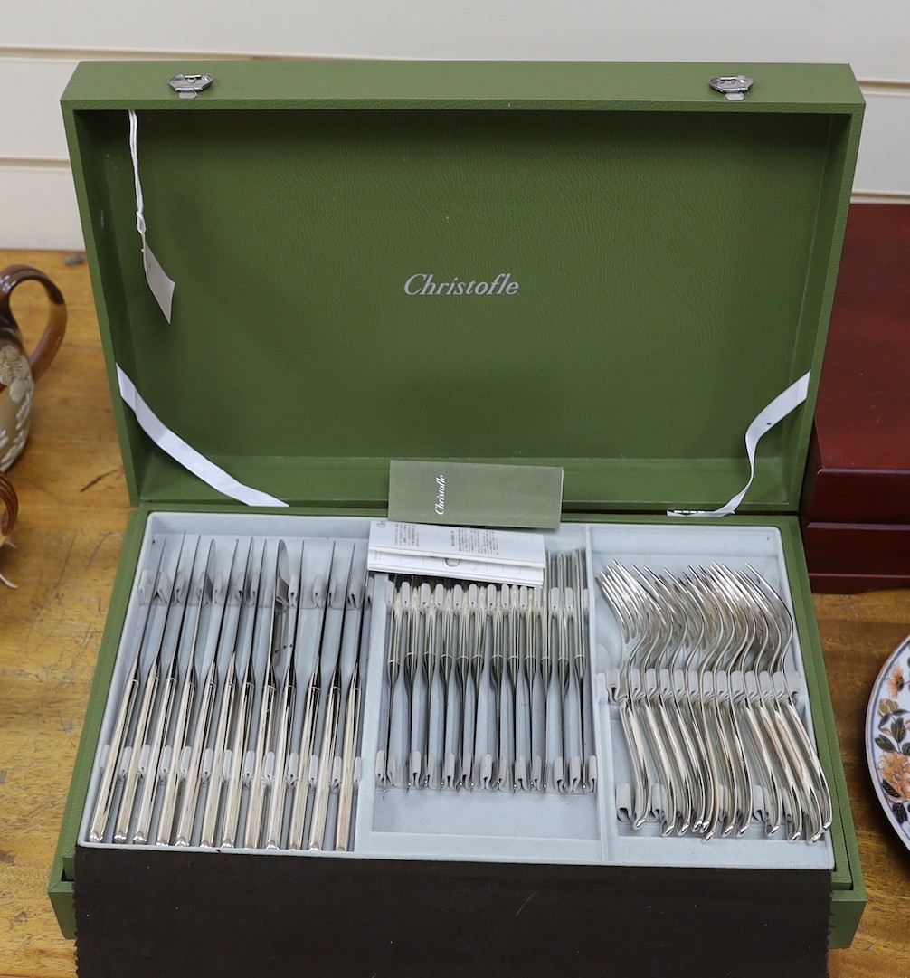 A Cristofle silver plated canteen of cutlery, comprising 84 items, in two trays.